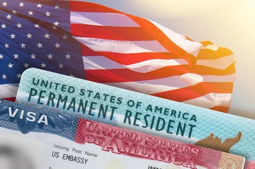 a US flag behind a permanent resident card 